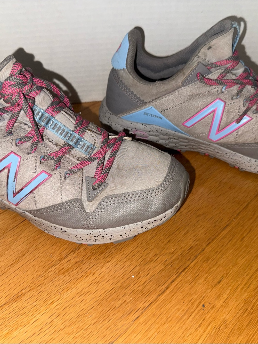 New Balance Kids Gray Sneakers with Pink Accents